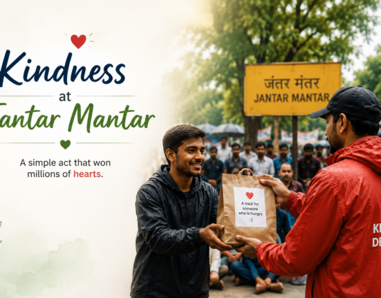 A delivery partner hands a food packet to a protester at Jantar Mantar, highlighting an inspiring act of kindness and community support.