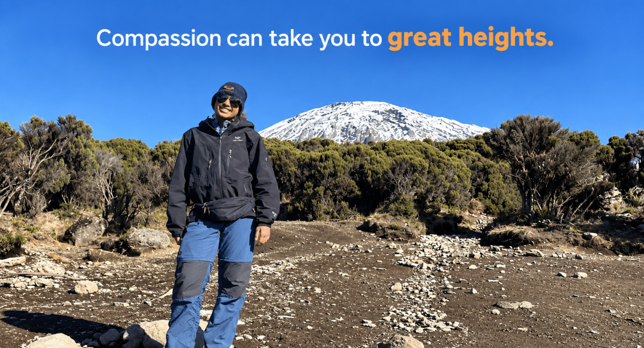 Ananya Jain standing on Mount Kilimanjaro with a snow-covered peak in the background.